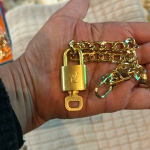Louis Vuitton preloved lock and key on unbranded bracelet or anklet.